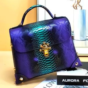 100% leather with embossed snake feature